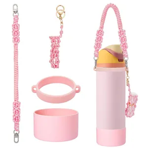 Pink handmade woven water bottle strap set with silicone boot and lipstick pouch accessories.