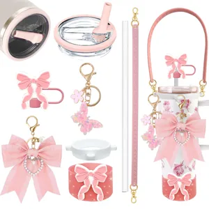 Pink cute tumbler accessory set with bowknot charm, butterfly keychain and straw cover for cup.