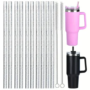 Set of glitter straws and cleaning brushes with pink and black tumblers for daily use.
