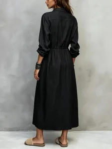 Black long sleeve shirt dress detail showing the drawstring waist and elegant midi length cut.