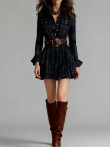 Detailed view of the vintage plaid long-sleeve shirt dress with chic belt and boots.