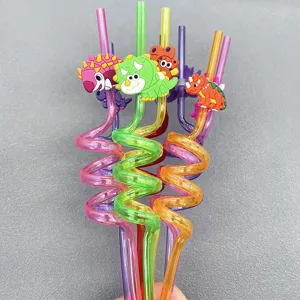 Colorful reusable plastic spiral drinking straws with cute cartoon dinosaur charms for kids.
