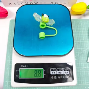 Detailed view of the cute creative acrylic wings straw cover dust cap with silicone ring.