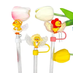 Cute cartoon chick straw toppers with acrylic angel wings and tulip decorations for drinks.