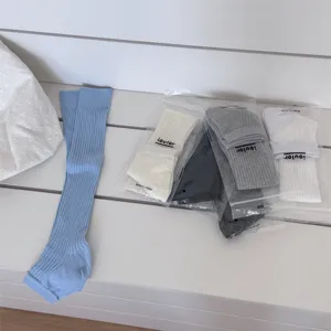 IOULOR solid color stirrup socks and stacked leg warmers for stylish daily wear.