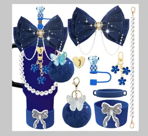 Blue Stanley cup accessories set including bow, pearl chain, pom pom and charms.