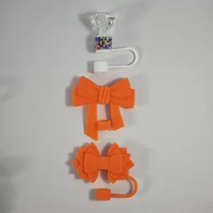 Silicone straw cover set with cute bow and diamond designs for Stanley cups dust plug accessories.