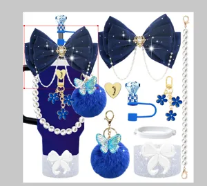 Tumbler accessory set featuring deep blue mesh bows, pearl chains, and fluffy butterfly charms.