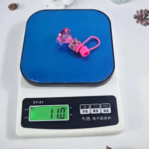 Detail shot of the pink diamond silicone straw cover with rhinestone bling on scale.