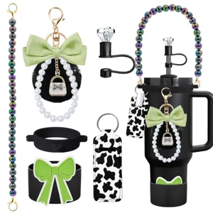 Detail view of tumbler accessories set including beaded strap, bow keychain, and leopard pouch.