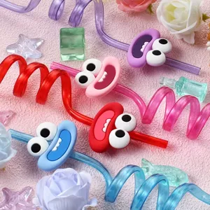 Colorful curly drinking straws with cute cartoon googly eyes, perfect for birthday parties.