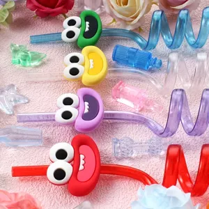 Colorful cartoon curly drinking straws with funny big eye mouth charms for party and bar.