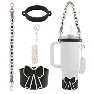 Handmade braided tumbler strap set with silicone boot and bow for Stanley cup accessories.