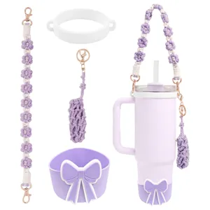 Handmade woven tumbler accessories set with purple floral strap and cute bow silicone boot.