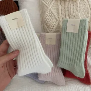 Detail view of thick winter warm women socks with cozy ribbed texture and plush rabbit hair blend.