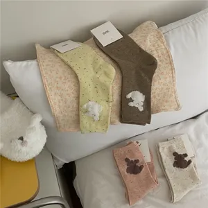 Detailed shot of cute fluffy puppy crew socks featuring soft texture and cozy daily wear.