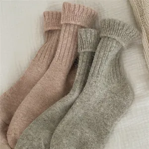 Cozy winter thick knit plush warm socks detail shot showing soft fuzzy texture and cute colors.