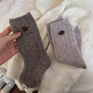 Thickened wool crew socks for women, cozy winter ribbed knit warm socks with cute button.