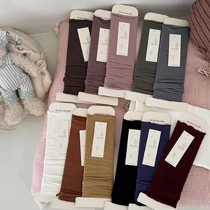 Multi-color solid slouch socks detail shot, comfortable cotton long socks for women.