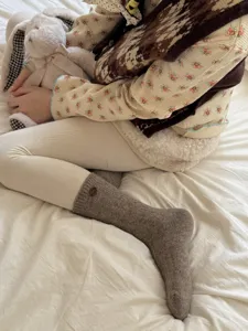 Cozy wool blend mid-calf socks with cute wooden button detail, soft autumn and winter wear.