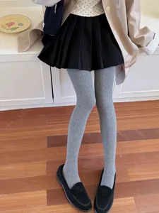 Grey ribbed knit pantyhose for women, elastic slim fit footed tights for daily wear.