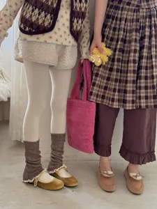 Cozy knit slouchy leg warmers with delicate lace trim, sweet Y2K style autumn winter accessory.