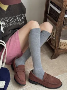 Comfortable solid grey calf socks for women, perfect for daily autumn and winter college style.