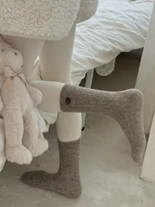 Cozy wool knit socks featuring a cute side button detail, soft and warm for winter daily wear.