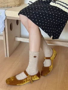 Cozy ribbed wool blend mid-calf socks with delicate button detail, comfortable daily wear