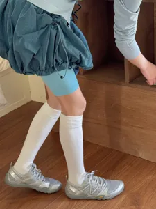 Solid white calf socks for women, comfortable cotton knee high socks for daily wear.