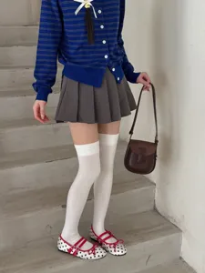 White over-the-knee socks detail shot, preppy style autumn winter long socks for women.