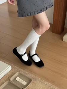 Detailed view of Japanese minimalist cable knit calf socks, solid color winter warm hosiery.