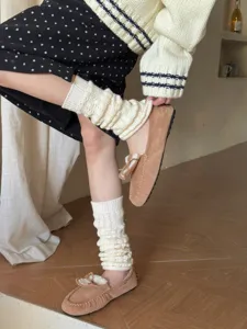 Cozy knit leg warmers for women, winter thermal boot cuffs and stylish footwear detail.