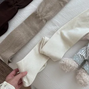 Detailed view of women knit over-the-knee socks in multiple colors for autumn and winter.