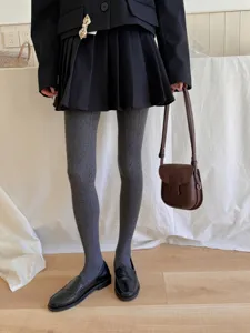 Grey cable knit pantyhose detail view, showing soft cotton texture and elastic fit for daily wear.