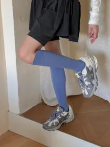 Detailed view of solid color blue compression calf socks, soft knit texture for everyday wear.