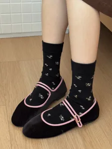 Chic floral mid-calf socks featuring delicate vintage patterns, perfect for cozy seasonal styling.