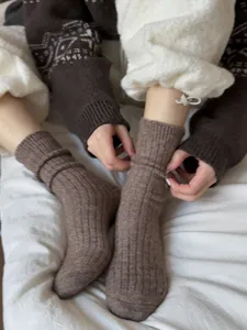 Detail shot of brown knitted wool socks winter warm thermal mid-tube daily wear soft cozy style