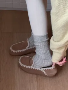 Detailed showcase of soft thick knit wool mid-tube socks, cozy winter thermal wear.
