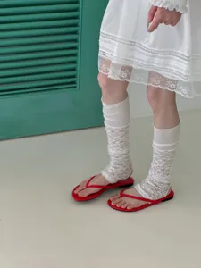 White lace slouch socks detail view, thin summer footed calf socks for women sweet Japanese style.