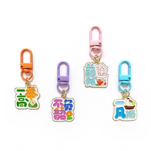 Colorful metal enamel keychains with motivational blessing text, detailed pendant close-up.