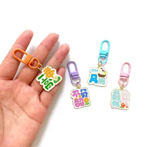 Metal enamel keychain set with inspirational Chinese text, colorful clasps for gifts.