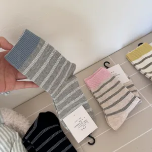 Japanese striped color-block crew socks for women, breathable combed cotton daily.