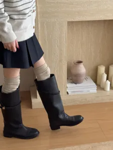 Korean style wool slouch knee-high socks for women, winter long boot socks, cozy outfit detail view.