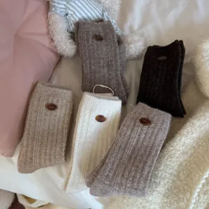 Chic Japanese style wool blend mid-calf socks with cute button decor for women autumn winter.