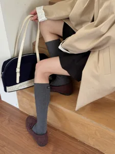 Korean style solid color mid calf cotton socks for women casual daily wear comfortable breathable.
