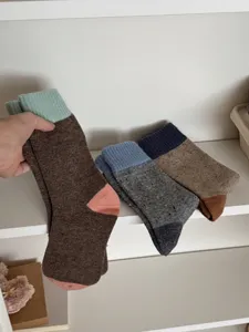 Cozy merino wool color-block mid-tube winter socks, thick thermal casual knit hosiery.