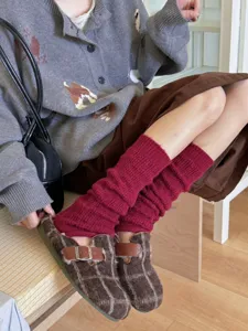 Dark red knit leg warmers detail shot, cozy Japanese style winter warm fashion apparel accessory