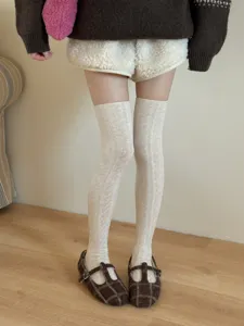 Sweet cable knit over-the-knee socks for women, cozy and stylish spring fall wear.