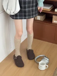 Women's Japanese cable-knit calf socks, solid color thickened winter fashion hosiery.